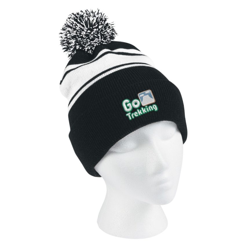 Styrofoam human head wearing a black and white beanie hat with text that’s says Go Trekking and a pompom on top